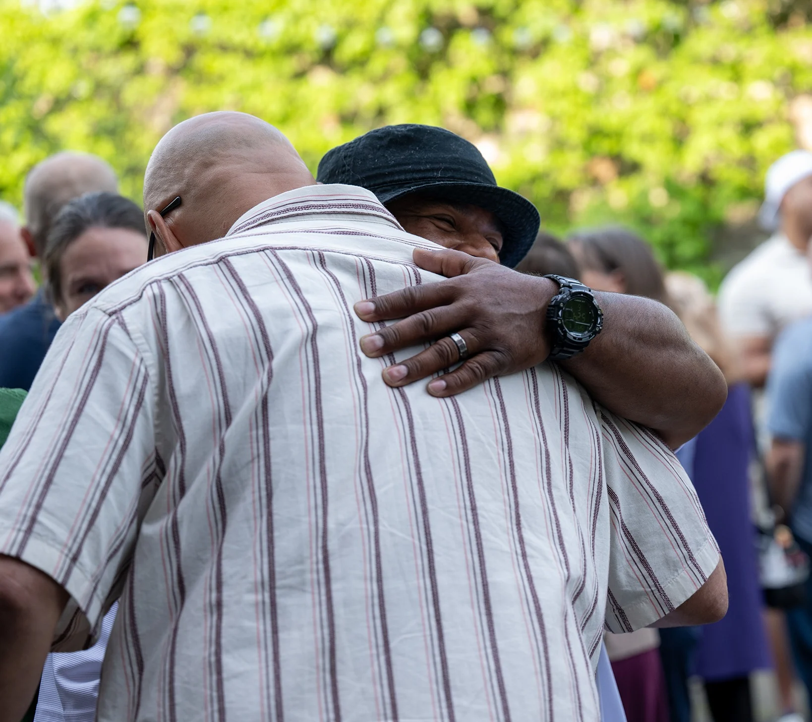 two men embrace